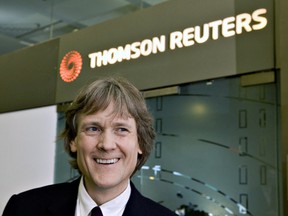David Thomson stands for a photo outside the Thomson Reuters office in Toronto.