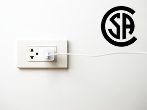 This stock photo shows a generic USB wall charger next to the CSA logo.