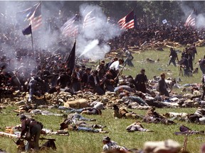 Federal reenacters of the July 5th Picketts Charge fire at the advanceing Confederate troops during the 135th anniverisery of the Civil War Battle of Gettysberg, PA.