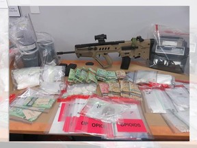 Abbotsford police say two search warrants lead to arrests, cash, drugs and gun seizure.