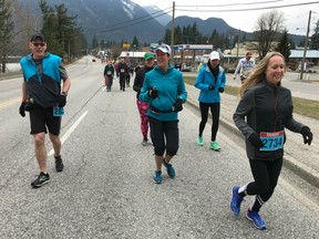 Barry Monkman of Abbotsford, left, shouts encouragement to runners as they tackle the first hill in Sunday's Inaugural Hope 10K and 5K Runs. MOre than 250 runners finished the challenging courses and helped raise money and awareness for the local food bank.