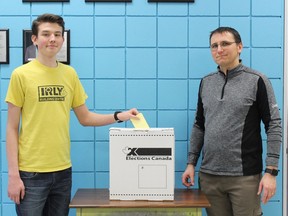Liam Christy, a Grade 11 student at Westsyde Secondary school in Kamloops, wants 16-year-olds including himself to have the right to vote. His social studies teacher, Jeremy Reid, poses for a photo with him.