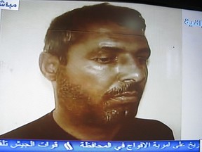 In this image taken from the al-Iraqiya television station, an image of Abu Omar al-Baghdadi, then one of the top leaders of al-Qaida in Iraq, is shown during a televised statement read by Maj. Gen Qassem Atta, head of Baghdad Operations on April 28 2009.