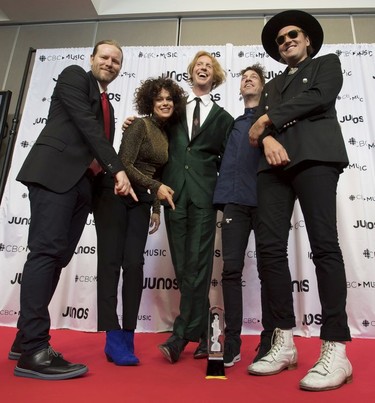 Members of Arcade Fire celebrate their Juno for International Achievement Award at the Juno Gala Dinner and Awards show in Vancouver, Saturday, March 24, 2018.