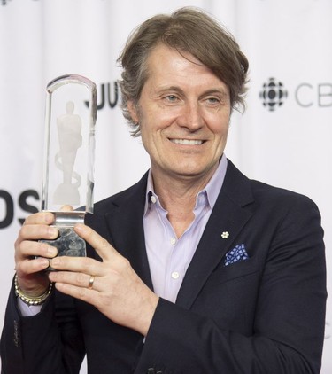 Jim Cuddy celebrates his Juno for the MusiCounts Inspired Minds Ambassador Award at the Juno Gala Dinner and Awards show in Vancouver, Saturday, March 24, 2018.