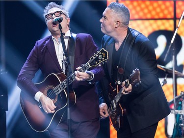 Ed Robertson, right, of the Barenaked Ladies, and former member and co-founder Steven Page, left, perform during the Juno Awards in Vancouver, B.C., on Sunday March 25, 2018.
