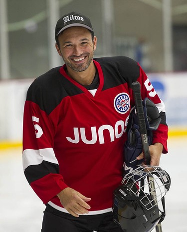 Victor Micallef of The Tenors smiles as Juno Cup players take to the ice for a practice at the Bill Copeland Sports Centre in Burnaby on March 22, 2018.