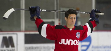 Musician Cosmo Ferraro stretches as Juno Cup players take to the ice for a practice at the Bill Copeland Sports Centre in Burnaby on March 22, 2018.