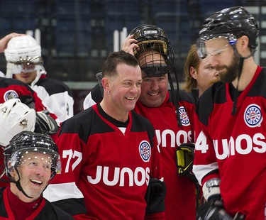Musicians Barney Bentall, Aaron Pritchett and Matt Sobb laugh as they take to the ice with NHL players and Olympians for a Juno Cup practice at the Bill Copeland Sports Centre in Burnaby on March 22, 2018.