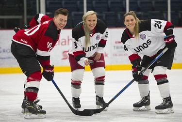 Musician Shawn Hook (left) and Olympians Kaillie Humphries (centre) and Natalie Spooner pose for a photo as Juno Cup players take to the ice for a practice at the Bill Copeland Sports Centre in Burnaby on March 22, 2018.