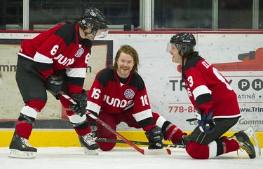 Musicians Darryl James (left, of The Strumbellas), JJ Shiplett (centre) and Dustin Bentall on the ice for a Juno Cup practice at the Bill Copeland Sports Centre in Burnaby on March 22, 2018.