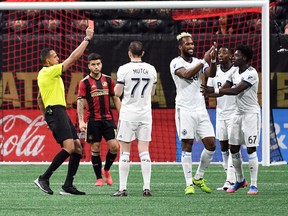 Vancouver Whitecaps defender Kendall Waston is issued a red card and ejected from the game after a video review where he elbowed Atlanta United defender Leandro Gonzalez (not pictured) during the first half at Mercedes-Benz Stadium.