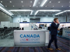 A man speaks on his phone while attending the Canada LNG Export Conference & Exhibition in Vancouver, B.C., on Thursday May 12, 2016.