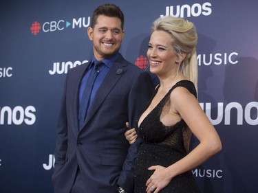 Michael Buble and wife Luisana Lopilato arrive on the red carpet at the Juno Awards in Vancouver, Sunday, March, 25, 2018.