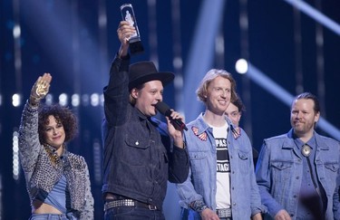 Arcade Fire celebrates their Juno for Album of the Year at the Juno Awards in Vancouver, Sunday, March, 25, 2018.