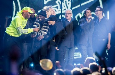 Kardinal Offishall, left, and members of Northern Touch and Eric McCormack, second right, perform with the Barenaked Ladies during the Juno Awards in Vancouver, B.C., on Sunday March 25, 2018.
