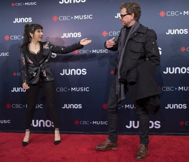 Briga, left, arrives on the red carpet at the Juno Awards in Vancouver, Sunday, March, 25, 2018.