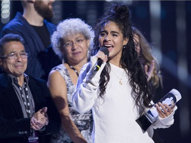 Jessie Reyez celebrates her Juno for Breakthrough Artist of the Year at the Juno Awards in Vancouver, Sunday, March, 25, 2018.