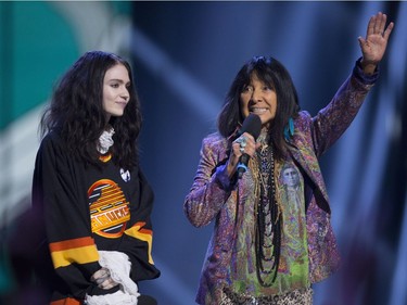Grimes and Buffy Sainte Marie are seen on stage at the Juno Awards in Vancouver, Sunday, March, 25, 2018.