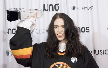 Grimes celebrates her juno for video of the year at the Juno Awards in Vancouver, Sunday, March, 25, 2018.