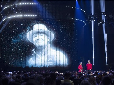 Kevin Drew, right, and Pearl Wenjack give a tribute to the late Gord Downie at the Juno Awards in Vancouver, Sunday, March, 25, 2018.