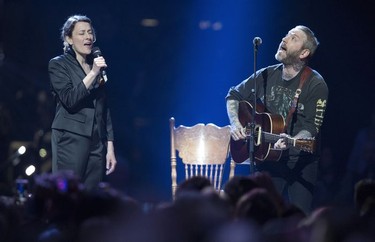 Sarah Harmer, left, and Dallas Green perform during a Gord Downie tribute at the Juno Awards in Vancouver, Sunday, March, 25, 2018.