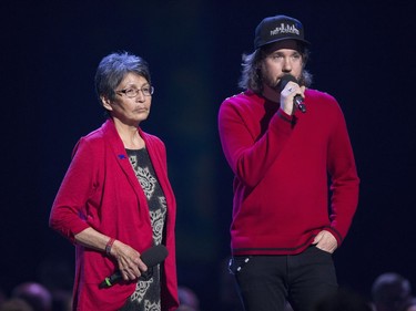 Pearl Wenjack, left, and Kevin Drew give a tribute to the late Gord Downie at the Juno Awards in Vancouver, Sunday, March, 25, 2018.