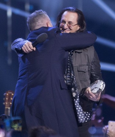 Geddy Lee presents The Barenaked Ladies with their Juno win for the Canadian Hall of Fame at the Juno Awards in Vancouver, Sunday, March, 25, 2018.