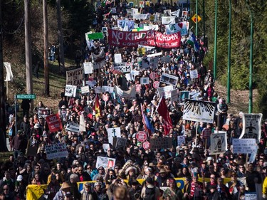 Thousands of people march together during a protest against the Kinder Morgan Trans Mountain pipeline expansion in Burnaby, B.C., on Saturday March 10, 2018.