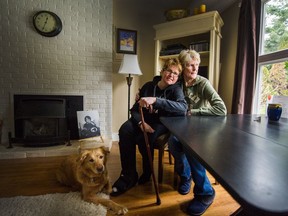 Sheila Gutsche (right) at home with her daughter Shara, and their dog Emily in Port Coquitlam. Shara, now 41, suffered a life-altering brain injury when hit by a drunk driver at age 13. (Photo: Arlen Redekop, PNG)