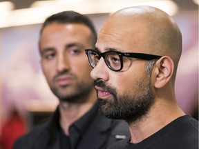 Mehran Seyed-Emami (left) listens while his brother Ramin speak to reporters after arriving from Iran at Vancouver International Airport in Richmond, March, 8, 2018. Their mother Maryam Mombeini, widow of Kavous Seyed-Emami, was barred from leaving Iran.