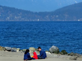 Sun seekers enjoy the balmy weather in Vancouver.