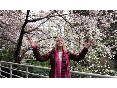 March 14, 2016: Linda Poole, director of the Vancouver Cherry Blossom Festival, with blooms at Burrard SkyTrain Station.