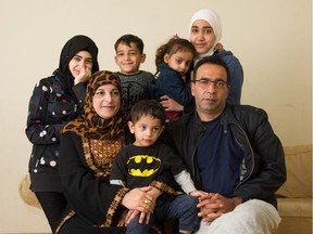 Bassam Sua'lfan and Yousra Al Qablawi and five of their seven children – left to right – Fatima, Mohammed, Karam, Rahaf and Yousra - at their home in Surrey, B.C., March 18, 2018.