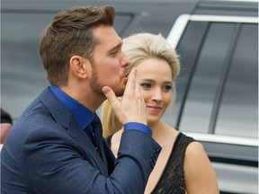 Michael Buble blows a kiss to fans as he arrives at the 2018 Juno Awards with his wife Luisana Lopilato at Rogers Arena in Vancouver Sunday.