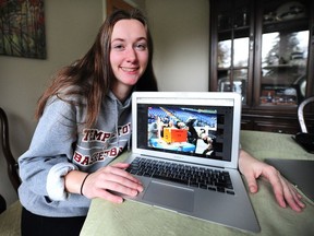 Nikki Cech, part of a small team of Templeton Secondary students that has qualified for a world robotics championship, shows a picture of the robot on her computer screen at her Vancouver home.