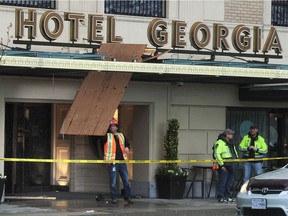 A worker is in hospital after falling through an awning at Vancouver's Hotel Georgia on Tuesday morning.