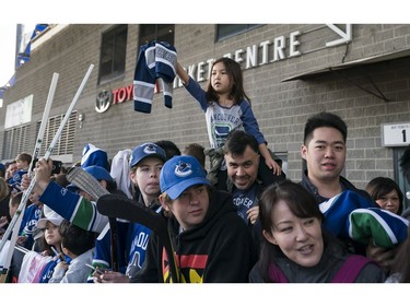 Vancouver Canucks fans line up to meet their favourite players prior to their NHL game against the Columbus Blue Jackets in Vancouver, BC, March, 31, 2018.