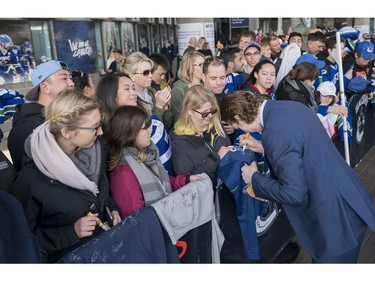 Vancouver Canucks Adam Gaudette meets with fans prior to their NHL game against the Columbus Blue Jackets in Vancouver, BC, March, 31, 2018.