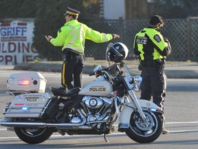Police direct traffic during a standoff in New Westminster on November 8, 2012.