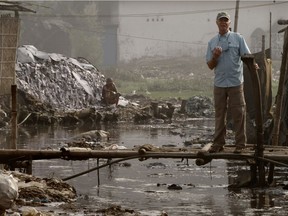 Mark Angelo stands on a small bridge in the heart of the extremely polluted Dhaka leather district. Angelo's documentary RiverBlue will be honoured at the World Water Forum this week in Brazil.