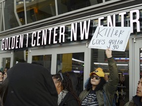Demonstrators protesting the fatal shooting of an unarmed black man gather outside Golden 1 Center before the tipoff of an NBA basketball game between the Atlanta Hawks and the Sacramento Kings in Sacramento, Calif., Thursday, March 22, 2018.