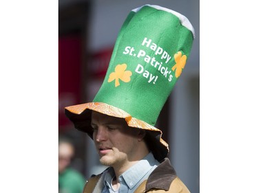 A man sports a Happy St Patrick's Day hat at the St. Patrick's Day party at the Blarney Stone, Vancouver, March 17 2018.