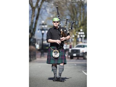 Mike Chisholm plays the bagpipes at the St. Patrick's Day party at the Blarney Stone, Vancouver, March 17 2018.