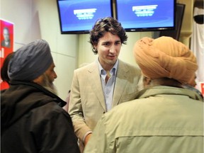 The Sikh faction that wins control of any one of the scores of large gurdwaras in Vancouver, Toronto and Calgary has often taken advantage of their access to money and influence to support certain Liberal and NDP candidates, say observers. (Photo: Justin Trudeau shakes hands with audience members at an event for Surrey Liberal candidates in 2011.)