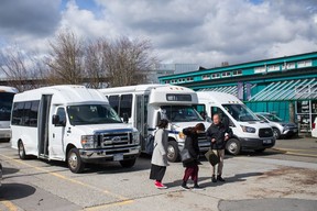 Tourist buses on Granville Island on Friday.  Under the new policy, buses must leave the island while passengers shop.