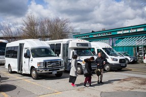 Tourist buses on Granville Island on Friday. Under the new policy, buses must leave the island while passengers shop.