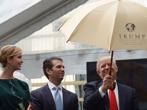 Ivanka Trump, left with brother Donald Jr. and father Donald Trump, in Vancouver in 2013. CNN says she is under investigation by the FBI for business dealings including the Trump Tower in Vancouver.