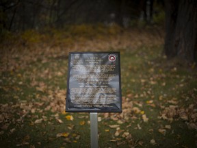 A plaque recognizing five wrongfully hung Tsilhqot'in Chiefs is pictured near the Fraser River in Quesnel.