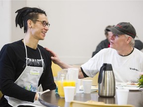 NBA star Jeremy Lin chats with Jeffrey at the Union Gospel Mission Easter lunch.